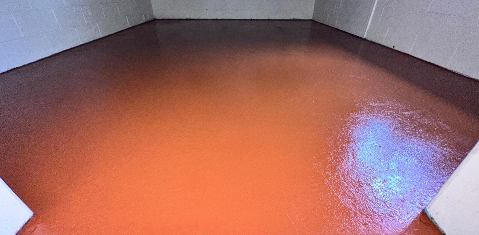 Epoxy Floor Coating by Brett Handyman – Noosa QLD Freshly painted epoxy-coated concrete floor in interior utility room – Noosa QLD